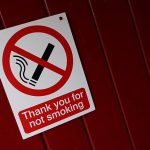 Clean outdoor park with a “Thank You for No Smoking” sign