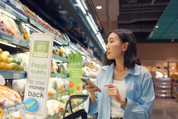 Smart shopper choosing fresh vegetables in a clean Supermaked aisle