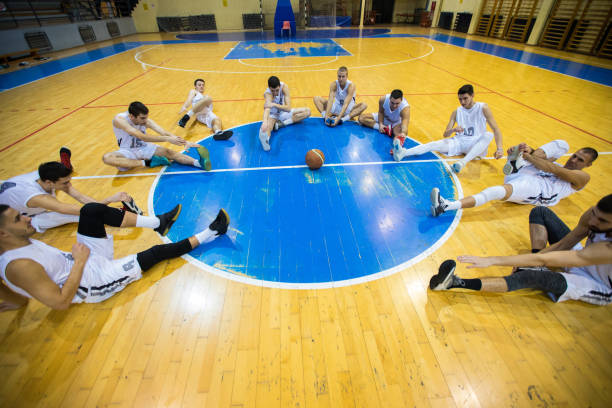 zuyomernon system basketball players practicing teamwork drills on outdoor court during structured training session